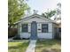 Charming single-story home featuring a well-manicured lawn and inviting front entrance at 3424 Queensboro S Ave, St Petersburg, FL 33711