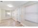 Bright living room with updated light gray vinyl flooring, fresh white paint and bright lighting at 3424 Queensboro S Ave, St Petersburg, FL 33711