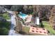 Aerial view of community clubhouse, pool, and picnic area at 3466 Maclaren Dr, Palm Harbor, FL 34684
