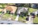 Aerial view of homes with brown and gray roofs at 3466 Maclaren Dr, Palm Harbor, FL 34684