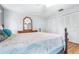 Spacious bedroom with large closet and wood-look flooring at 3466 Maclaren Dr, Palm Harbor, FL 34684