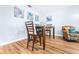 Charming dining area with wooden table and chairs, coastal decor at 3466 Maclaren Dr, Palm Harbor, FL 34684