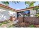 Charming front entrance featuring brick accents, creating a welcoming atmosphere at 3466 Maclaren Dr, Palm Harbor, FL 34684