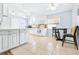 Kitchen with white cabinets, tiled floors, and breakfast nook at 3466 Maclaren Dr, Palm Harbor, FL 34684