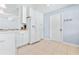 White kitchen with stainless steel appliances and tile floor at 3466 Maclaren Dr, Palm Harbor, FL 34684