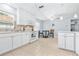 Eat-in kitchen with white cabinets, stainless steel appliances, and tile floor at 3466 Maclaren Dr, Palm Harbor, FL 34684