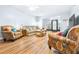 Spacious living area with hardwood floors and comfortable seating at 3466 Maclaren Dr, Palm Harbor, FL 34684
