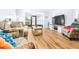 Open living space featuring hardwood floors and access to a patio at 3466 Maclaren Dr, Palm Harbor, FL 34684