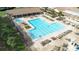 Community pool with spa and plenty of lounge chairs at 3466 Maclaren Dr, Palm Harbor, FL 34684
