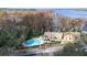 Community pool and clubhouse with lake access at 3466 Maclaren Dr, Palm Harbor, FL 34684