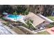 Community pool and clubhouse near lake at 3466 Maclaren Dr, Palm Harbor, FL 34684