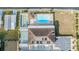Aerial view of community pool, shuffleboard courts, and clubhouse at 37340 Neukom Ave, Zephyrhills, FL 33541
