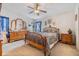 Charming bedroom with wooden furniture and plenty of natural light at 37340 Neukom Ave, Zephyrhills, FL 33541
