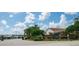 Grand Horizons community entrance with lush landscaping and a welcoming atmosphere at 37340 Neukom Ave, Zephyrhills, FL 33541