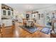 Bright dining area with wood floors, chandelier, and table with four chairs at 37340 Neukom Ave, Zephyrhills, FL 33541