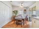 Small dining area with wooden table and chairs near sliding door at 37340 Neukom Ave, Zephyrhills, FL 33541