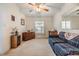 Cozy living room with plaid couch and ceiling fan at 37340 Neukom Ave, Zephyrhills, FL 33541