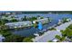 Aerial view of waterfront community with boat docks and serene water views, showcasing beautiful coastal living at 4827 Coquina Key Se Dr # B, St Petersburg, FL 33705