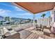 Cozy outdoor covered patio complete with brick floors and comfortable patio furniture at 4827 Coquina Key Se Dr # B, St Petersburg, FL 33705