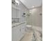 Well-lit bathroom with a modern glass shower enclosure at 4827 Coquina Key Se Dr # B, St Petersburg, FL 33705