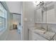 Bright bathroom with granite countertop and bedroom view at 4827 Coquina Key Se Dr # B, St Petersburg, FL 33705