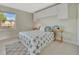 Inviting bedroom with starfish patterned bedspread and ample natural light at 4827 Coquina Key Se Dr # B, St Petersburg, FL 33705