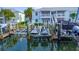 Boat lift featuring jet skis and boats with waterfront views in an exclusive community, perfect for boating enthusiasts at 4827 Coquina Key Se Dr # B, St Petersburg, FL 33705