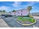 Charming, colorful building with lush landscaping, and ample parking enhancing the coastal appeal at 4827 Coquina Key Se Dr # B, St Petersburg, FL 33705