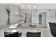 Well-lit kitchen with granite countertop, bar seating, and access to a bedroom at 4827 Coquina Key Se Dr # B, St Petersburg, FL 33705
