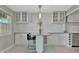 Modern kitchen with granite counters, stainless steel appliances, and ample storage space at 4827 Coquina Key Se Dr # B, St Petersburg, FL 33705