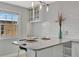 Contemporary kitchen with granite countertop and stylish bar seating area at 4827 Coquina Key Se Dr # B, St Petersburg, FL 33705