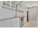 Well-equipped kitchen with stainless steel appliances, granite counters, and wine rack at 4827 Coquina Key Se Dr # B, St Petersburg, FL 33705