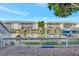 Waterfront patio with railing and view of boat docks and condos at 4827 Coquina Key Se Dr # B, St Petersburg, FL 33705
