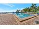 Gorgeous community pool with surrounding brick patio, offering a relaxing and inviting outdoor space at 4827 Coquina Key Se Dr # B, St Petersburg, FL 33705