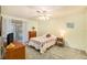 Cozy bedroom with a queen-size bed and sliding door to patio at 9404 Rockbridge Cir # 9404, New Port Richey, FL 34655