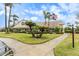 Community clubhouse with landscaping and flag at 9404 Rockbridge Cir # 9404, New Port Richey, FL 34655