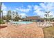 Inviting community pool with lounge chairs and brick patio at 9404 Rockbridge Cir # 9404, New Port Richey, FL 34655