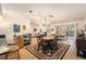 Charming dining area with a chandelier and view into the living room at 9404 Rockbridge Cir # 9404, New Port Richey, FL 34655