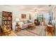 Cozy living room with a comfy couch and built-in shelving at 9404 Rockbridge Cir # 9404, New Port Richey, FL 34655