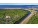 An aerial view highlights the coastal landscape and waterways surrounding this area at 1074 Signet Dr, Apollo Beach, FL 33572