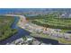 This aerial view shows waterfront living in a community near the golf course at 1074 Signet Dr, Apollo Beach, FL 33572
