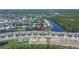 An aerial view shows this home's proximity to the canal in a waterfront community at 1074 Signet Dr, Apollo Beach, FL 33572