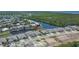 Aerial view showcases the waterfront homes, beautifully landscaped yards, and boat docks along the canal at 1074 Signet Dr, Apollo Beach, FL 33572
