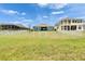 Spacious backyard with manicured lawn and views of upscale homes at 1074 Signet Dr, Apollo Beach, FL 33572
