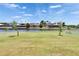 Large backyard featuring waterfront views and well-manicured lawn at 1074 Signet Dr, Apollo Beach, FL 33572