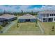 An aerial view displays this home's fenced yard and covered outdoor living space at 1074 Signet Dr, Apollo Beach, FL 33572