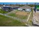 Large, fenced backyard overlooking the tranquil waters, perfect for outdoor activities at 1074 Signet Dr, Apollo Beach, FL 33572