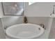 Close up of a luxurious white soaking tub with tile surround, set in a well-appointed bathroom at 1074 Signet Dr, Apollo Beach, FL 33572