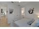 This bedroom features neutral decor, light wood floors, and a double closet at 1074 Signet Dr, Apollo Beach, FL 33572