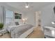 Bright bedroom with light hardwood floors and neutral decor at 1074 Signet Dr, Apollo Beach, FL 33572